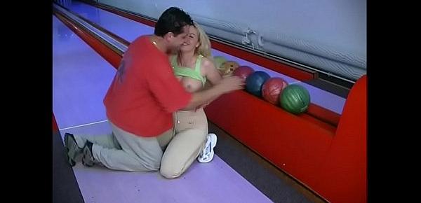  Blonde in a bowling enjoys another kind of pins